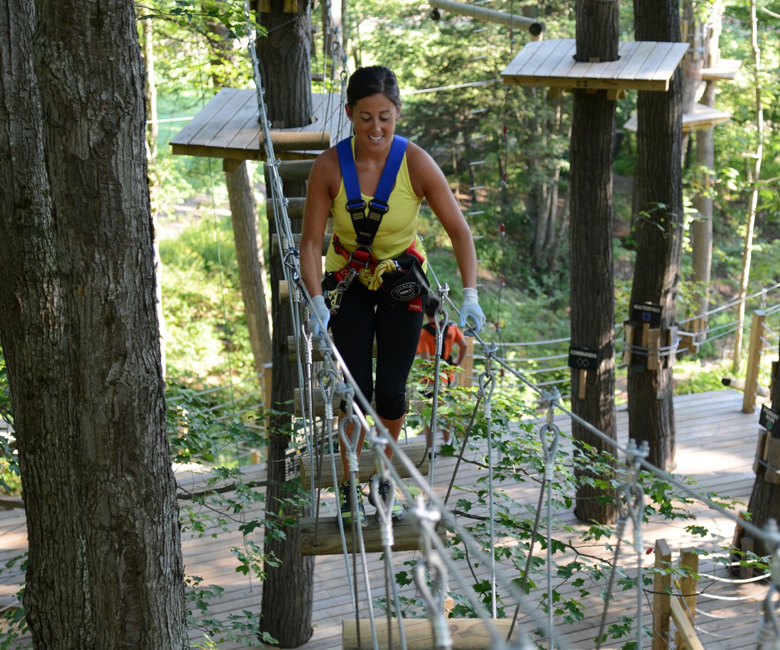Woman on aerial obstacle course at Sky High Adventure Park